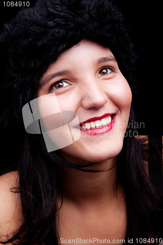 Image of Beautiful young woman smiling with hat