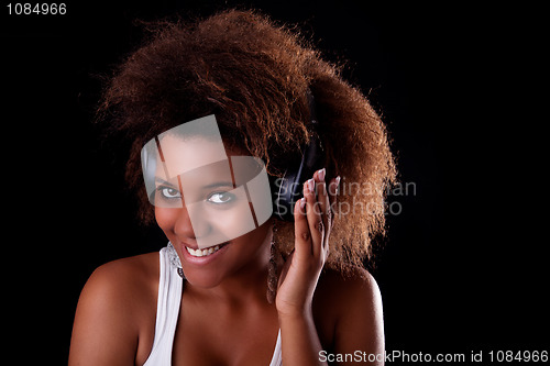Image of Beautiful black woman happy listening music in headphones