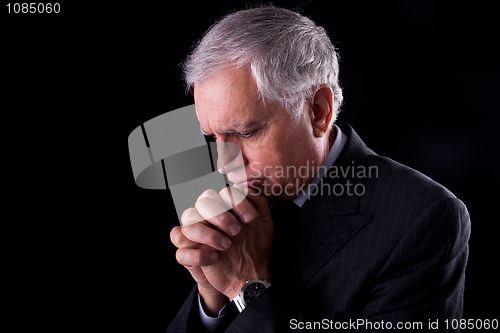 Image of Portrait of a handsome mature businessman, thinking-praying