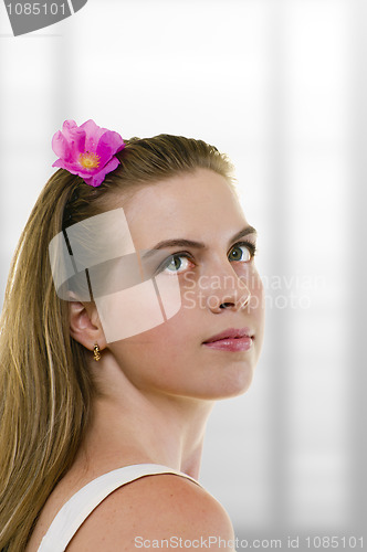 Image of young woman with flower in her hair