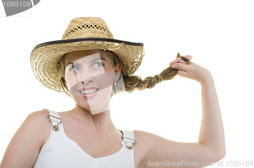 Image of young woman in worn straw  hat