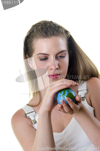 Image of Woman look all over small globe