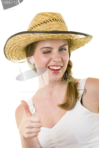 Image of happy woman in worn straw  hat