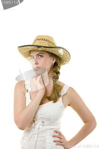 Image of Smiling woman in worn straw  hat