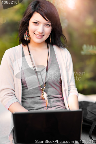 Image of Mixed race college student with laptop