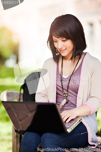 Image of Mixed race college student with laptop