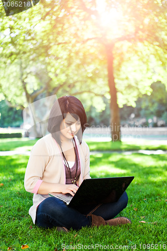 Image of Mixed race college student with laptop