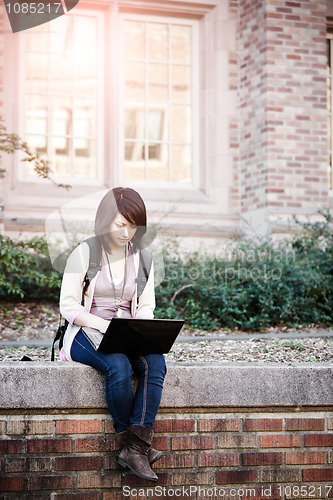 Image of Mixed race college student with laptop