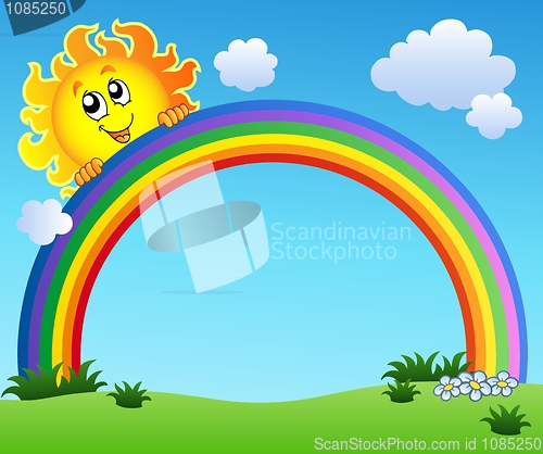 Image of Sun holding rainbow on blue sky