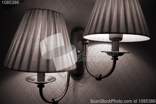 Image of Photo of wall lamp with dim light   