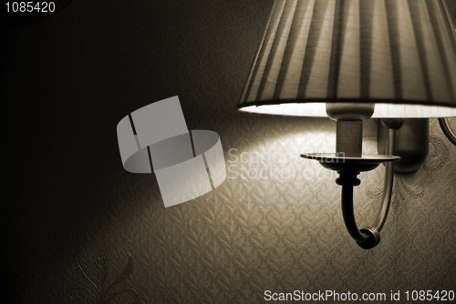 Image of Photo of wall lamp with dim light    