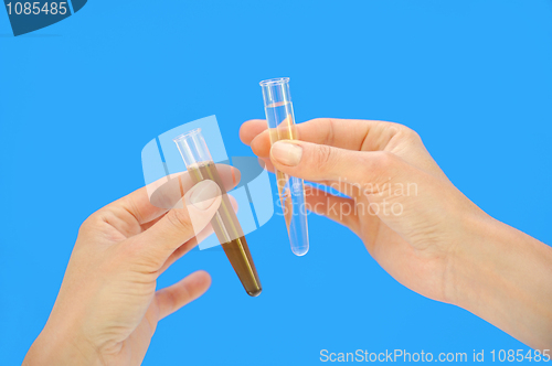 Image of Clean and dirty water samples in hands