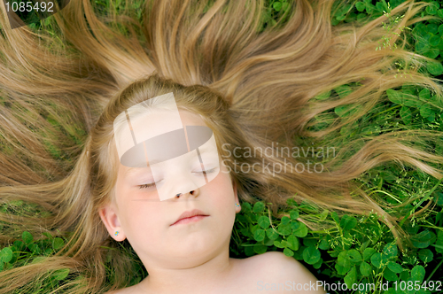 Image of Little girl sunbathing