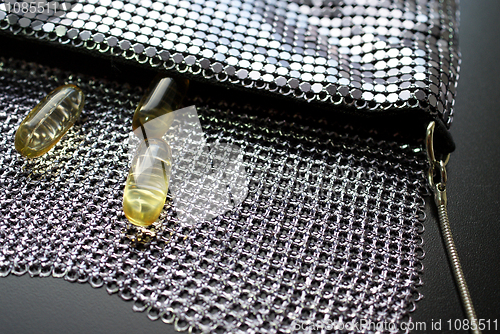 Image of Fish Oil Capsules in Evening Bag