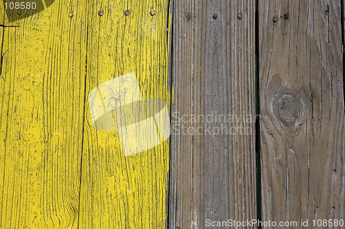 Image of Yellow painted wooden planks