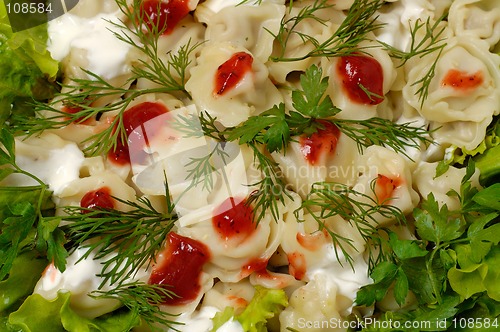 Image of Ravioli with greens sour cream and ketchup dish