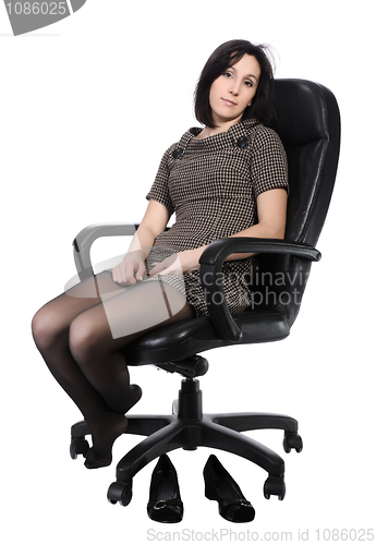 Image of Girl in brown dress in an office chair, isolated