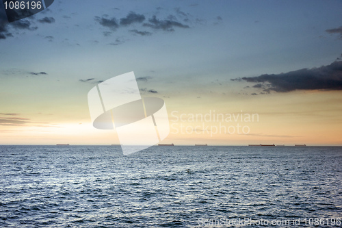 Image of ocean waves at sunset