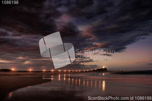 Image of lighthouse and breakwater at night