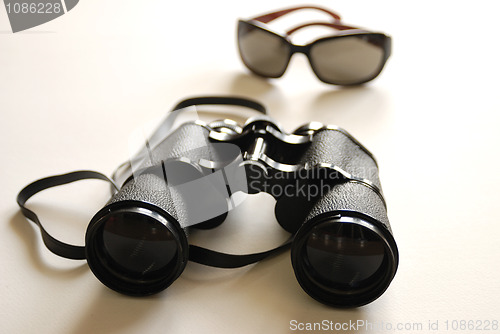 Image of binoculars and sunglasses