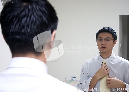 Image of Young Asian Man Preparing to Work