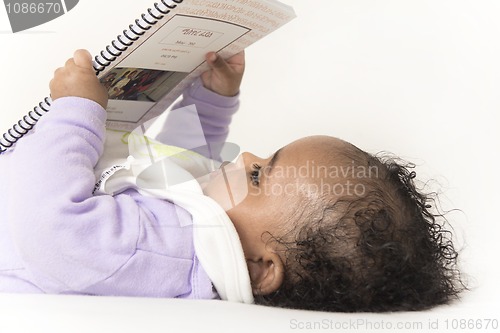 Image of Baby reading a book