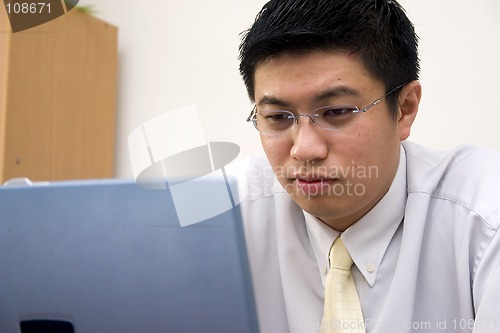 Image of Young Asian Entrepreneur Working with Computer