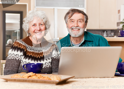 Image of Senior couple using computer