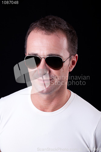 Image of Portrait of a handsome middle-age man smiling with sunglasses