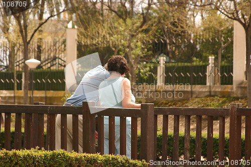 Image of backview couple on a bridge