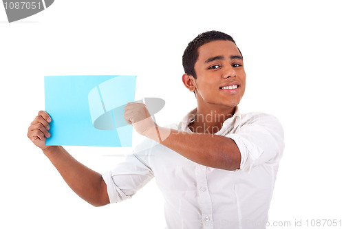 Image of young latin man, with blue  card in hand, smiling