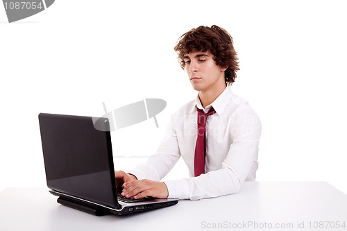 Image of young businessman on the computer