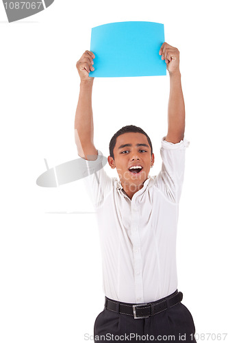 Image of happy young latino man, raised arms with blue card in hand