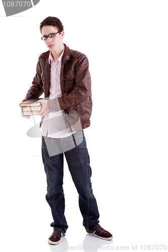 Image of young and handsome young man, with books on the hands