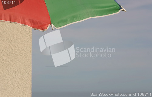 Image of parasol in green and red with write space