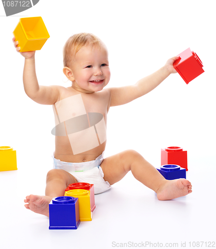 Image of Happy little boy with building bricks