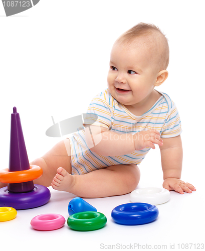Image of Little boy play with toys