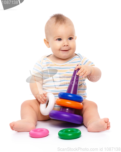 Image of Little boy play with toys