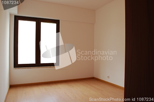 Image of Empty and clean room with wooden floor