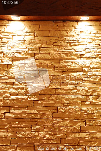 Image of Unshaped stone wall with spot lights