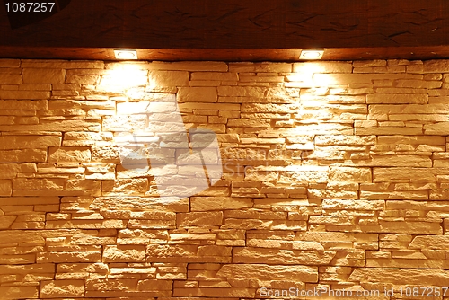 Image of Unshaped stone wall with spot lights