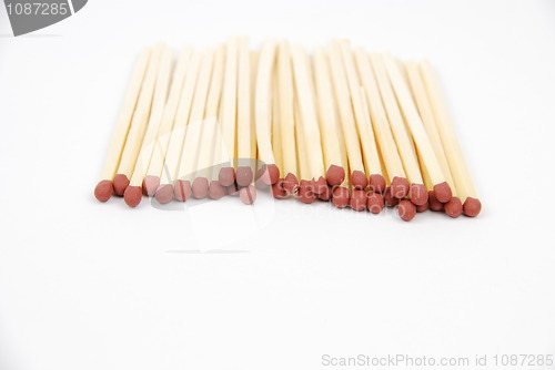 Image of Red matches on white (close-up)
