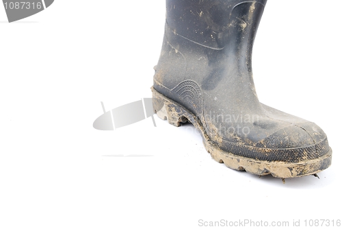 Image of Black rubber boot on white