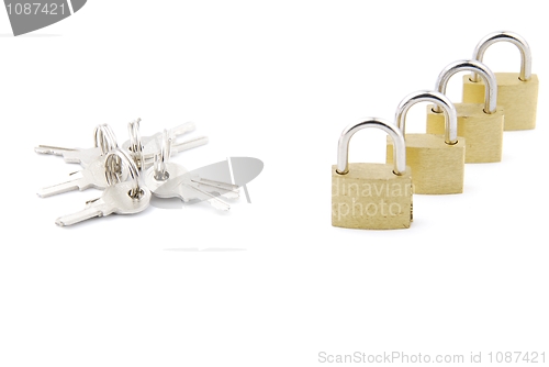Image of Golden closed padlocks with keys on white