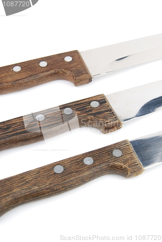 Image of Close-up of wooden kitchen knifes on white