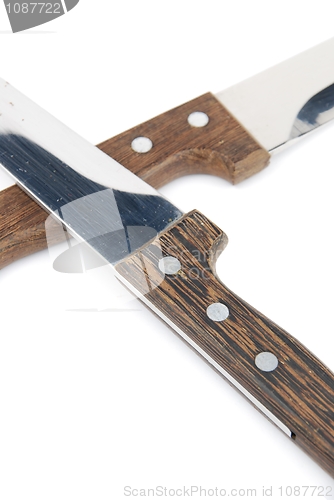 Image of Close-up of wooden kitchen knifes on white