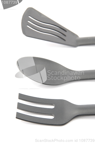 Image of Black plastic kitchen utensil on white