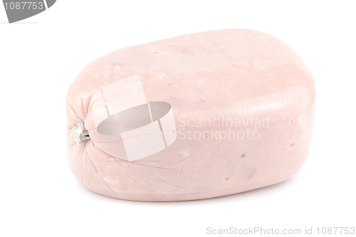 Image of All ham piece wrapped with plastic on white