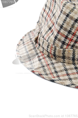 Image of Close-up of a checked brown hat on white