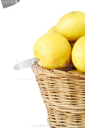 Image of Close-up of lemons in a wicker basket on white